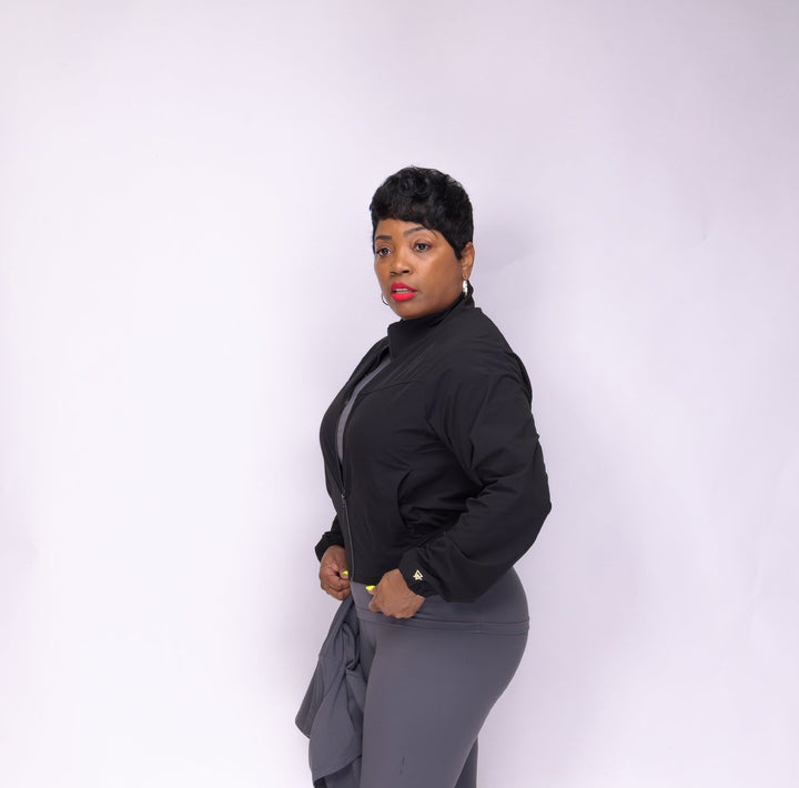 Stylish woman wearing a black Pooh Wear Jacket designed by Avanda