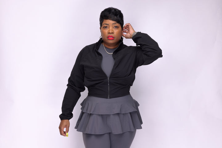 Stylish woman wearing a black Pooh Wear Jacket designed by Avanda