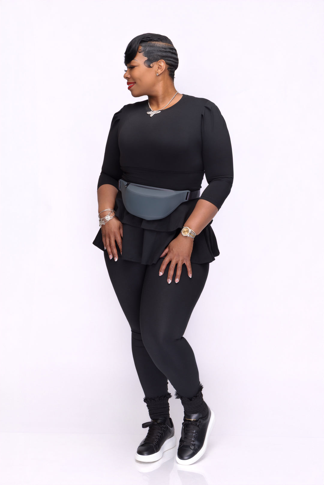 Stylish woman wearing a Pooh Wear athletic outfit with a Pooh Wear Work pouch (fanny pack)