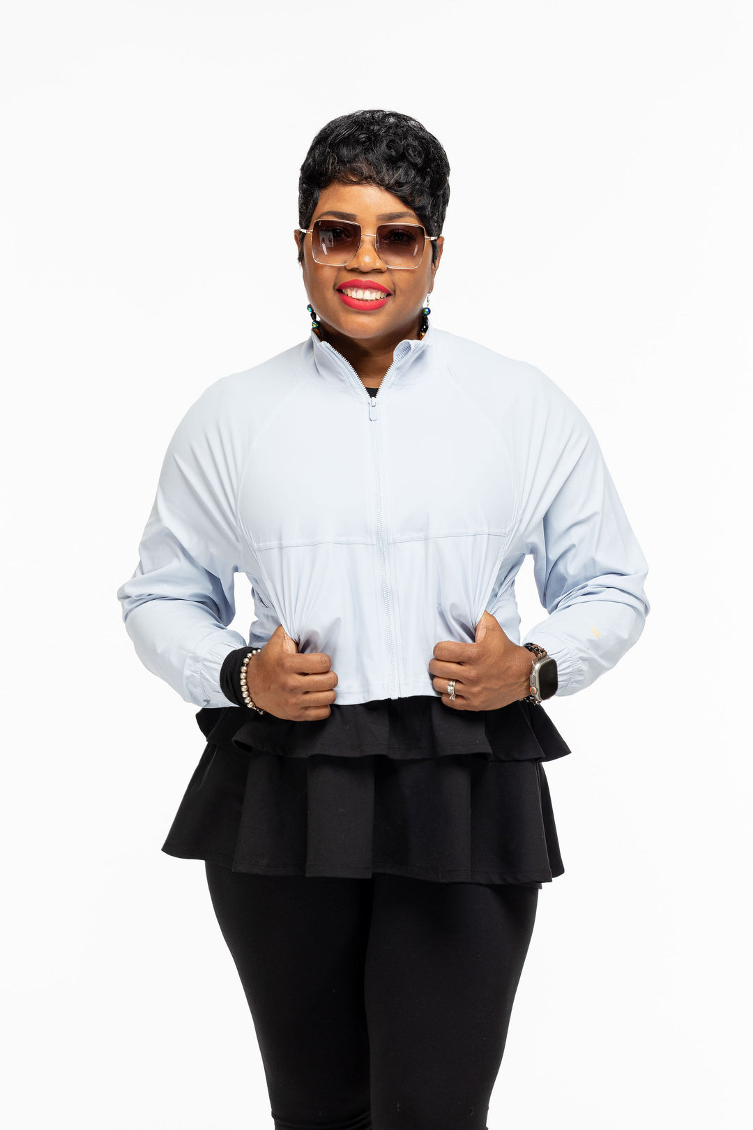 Stylish woman wearing a Pooh Wear Work to Workout athletic outfit with Pooh Wear Work jacket.