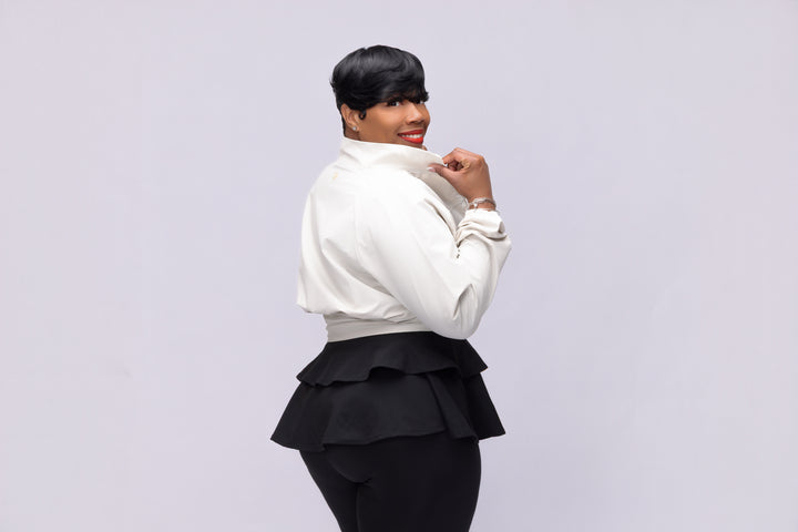 Stylish woman wearing a cream Pooh Wear Jacket designed by Avanda