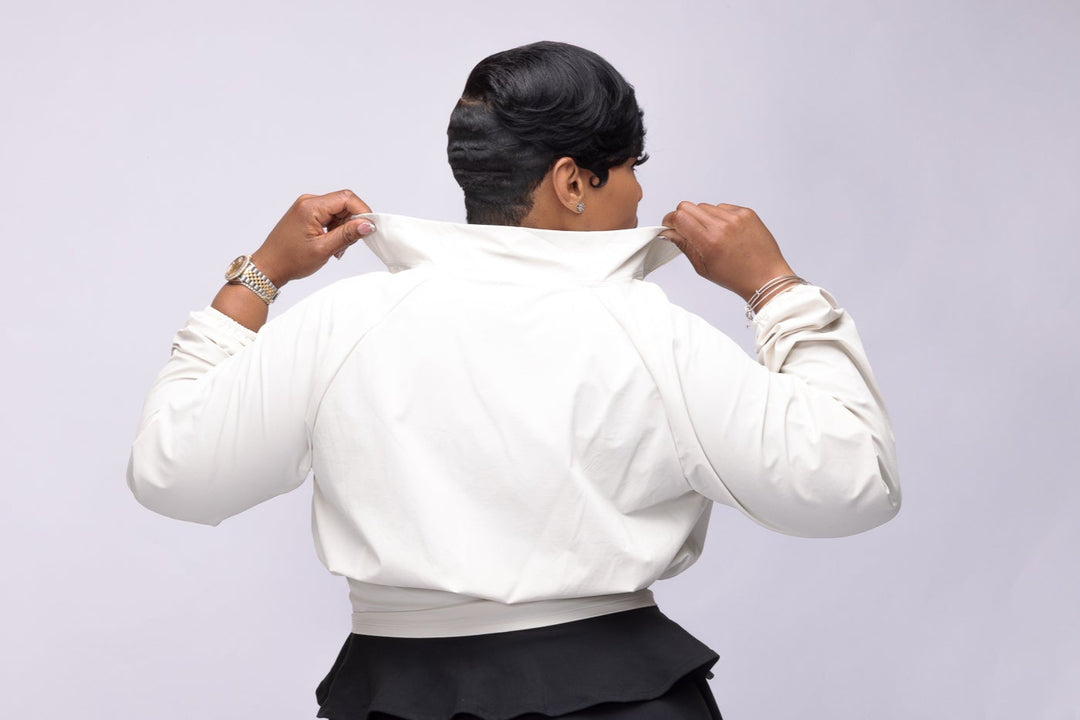 Stylish woman wearing a cream Pooh Wear Jacket designed by Avanda