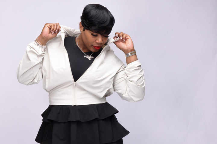 Stylish woman wearing a cream Pooh Wear Jacket designed by Avanda