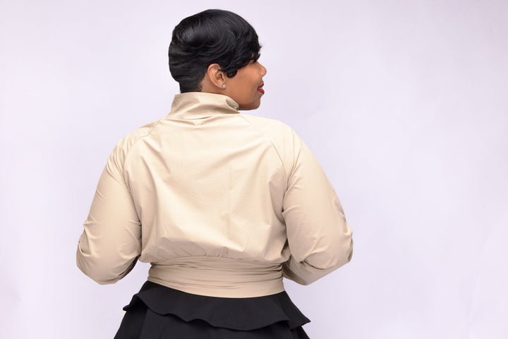 Stylish woman wearing a Pooh Wear athletic outfit with a Pooh Wear Work jacket