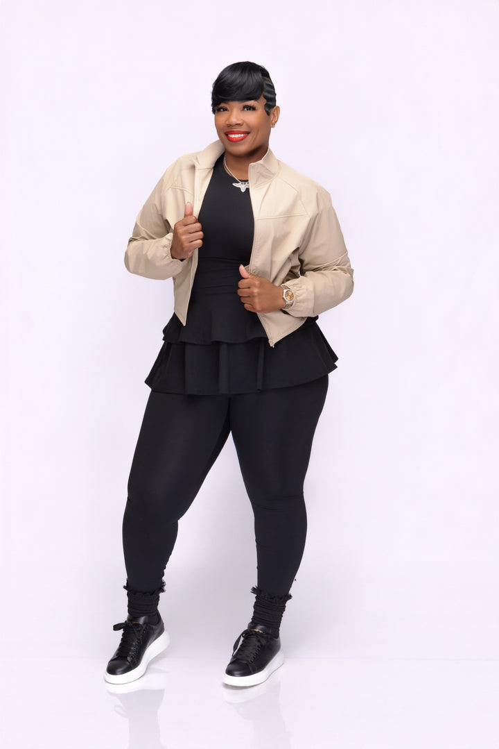 Stylish woman wearing a Pooh Wear Work to Workout athletic outfit with Pooh Wear Work jacket.