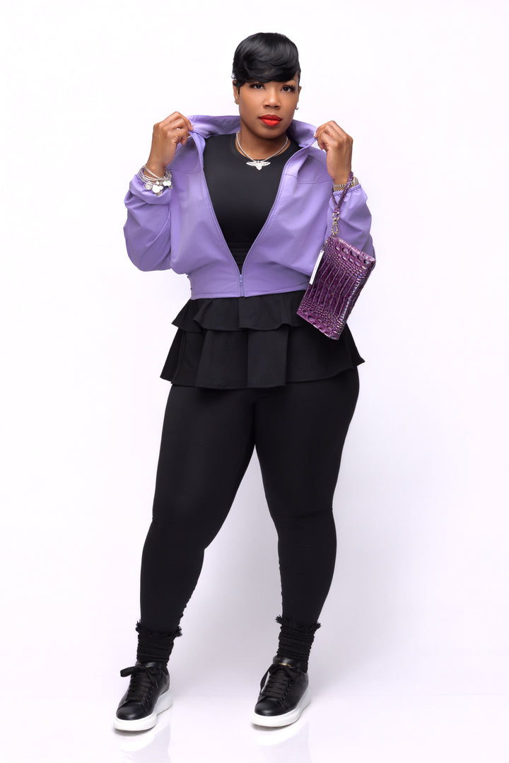 Woman wearing lavender Pooh Wear jacket. 