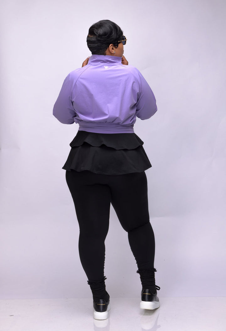 Woman wearing lavender Pooh Wear jacket. 