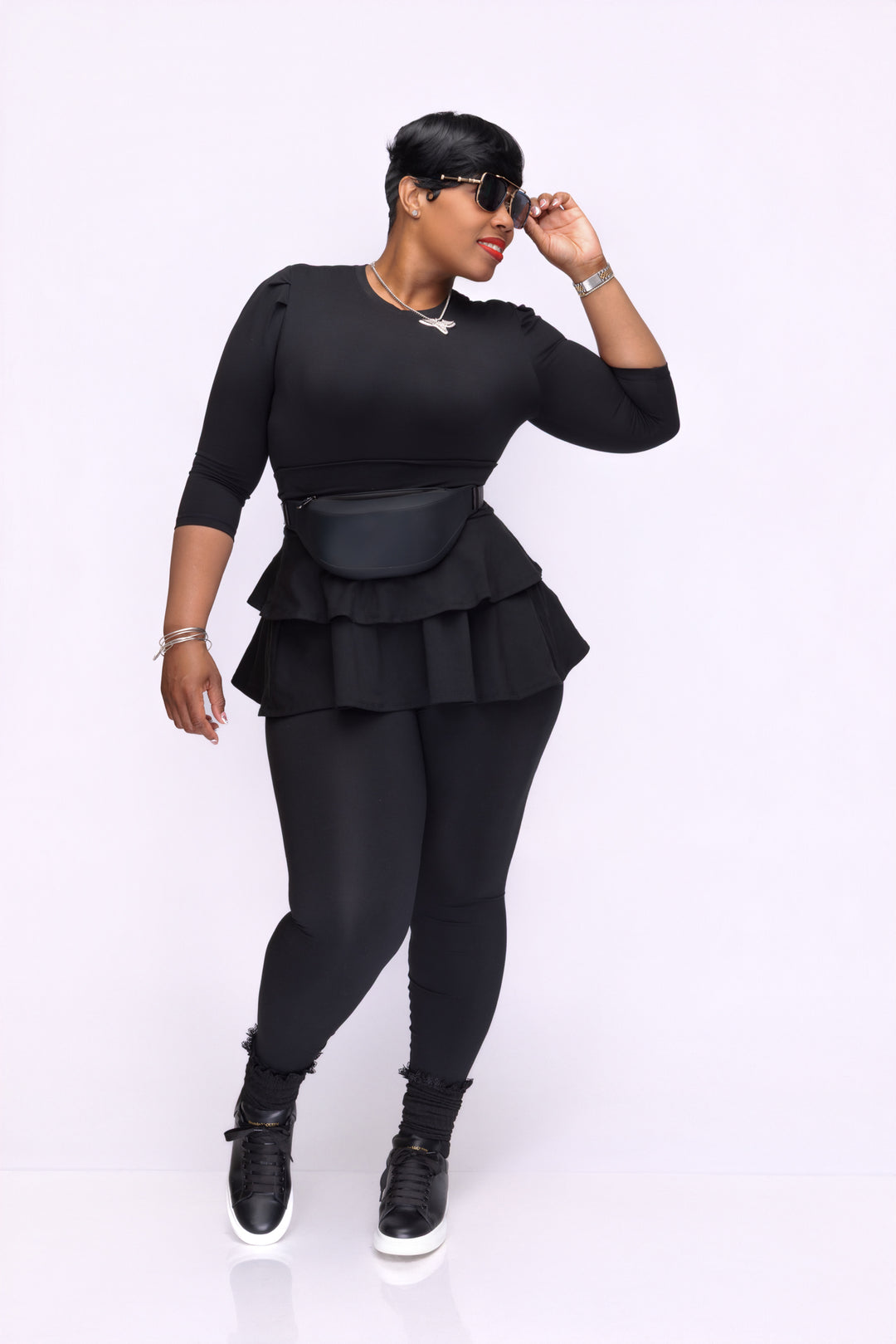 Stylish woman wearing a Pooh Wear Work to Workout athletic outfit with Pooh Wear Work to Workout pouch (fanny pack).