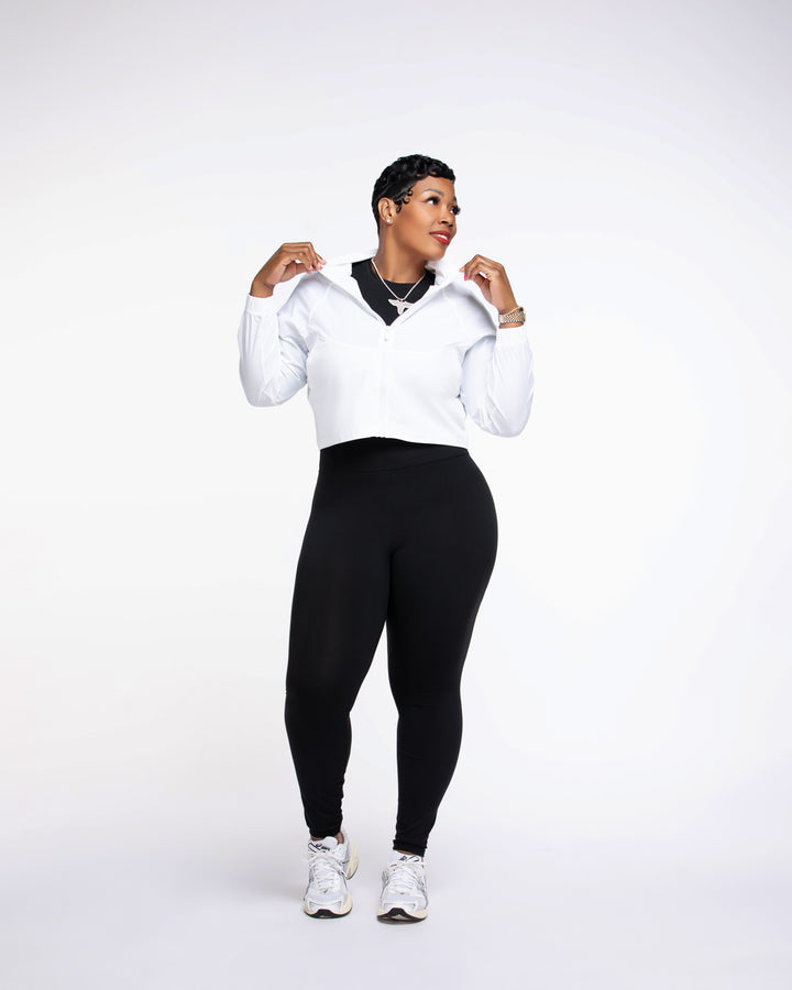 Stylish woman wearing a Pooh Wear Work to Workout athletic outfit with Pooh Wear Work jacket.