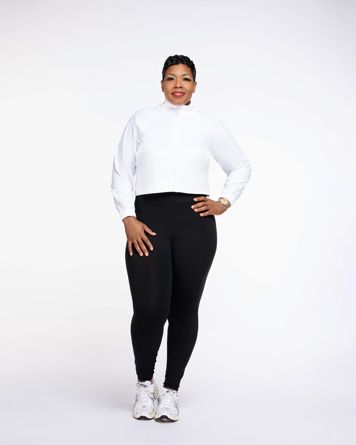 Stylish woman wearing a Pooh Wear Work to Workout athletic outfit with Pooh Wear Work jacket.