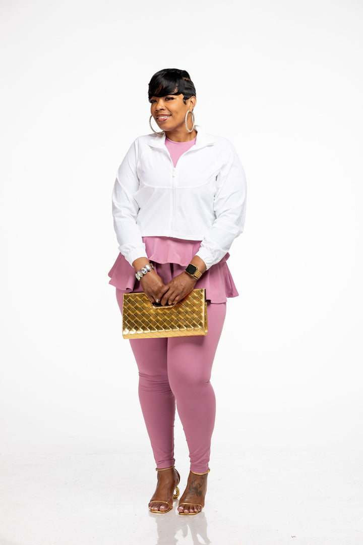 Stylish woman dressing up a Pooh Wear Work to Workout athletic outfit with Pooh Wear Work jacket.